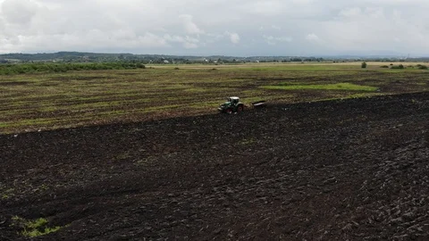 Tractor blows up land. Black soil. Farmland Stock Footage 112223512