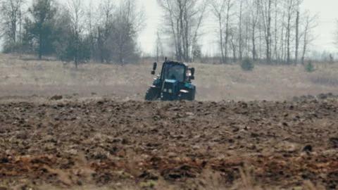 Tractor blue colour with big black wheels and a powerful grouser, heavy plows 库存影片 106548913