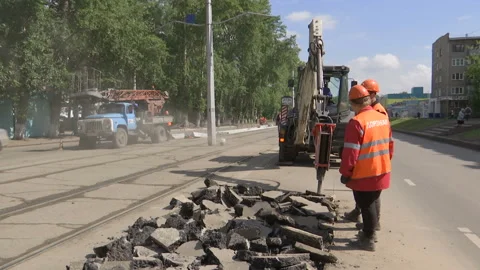 Tractor break down asphalt with hydraulic pneumatic hammer. Stock Footage 131960071