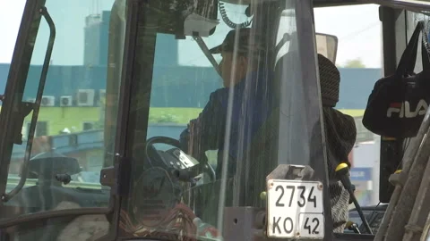 Tractor break down asphalt with hydraulic pneumatic hammer. Stock Footage 131960328