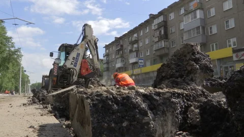 Tractor break down asphalt with hydraulic pneumatic hammer. Stock Footage 131960333
