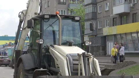 Tractor break down asphalt with hydraulic pneumatic hammer. Stock Footage 131960622