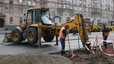 Tractor break down asphalt with hydraulic pneumatic hammer. Stock Footage 132198621