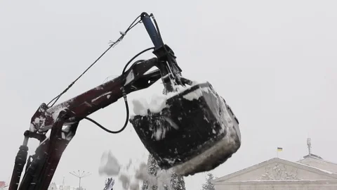 The tractor bucket cleans the snow Stock Footage 83646994