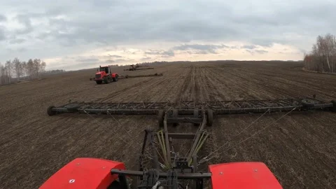 Tractor buries field during day timelapse Stock Footage 196981380