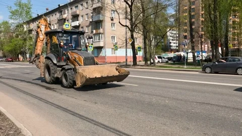 Tractor on city streets Stock Footage 239659657