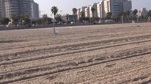 Tractor cleaning  the beach Stock Footage 12189452