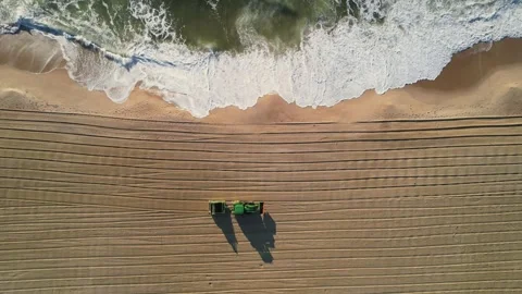 Tractor Cleaning the Sandy Beach Stock Footage 241028753