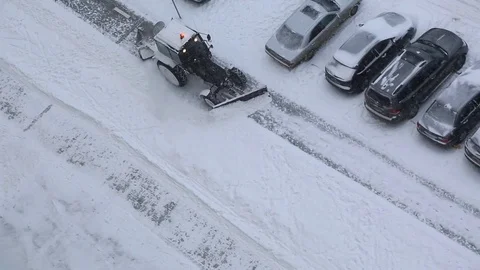 Tractor is cleaning sidewalk in winter Video stock 83464949