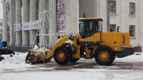 Tractor cleaning snow in the park Stock Footage 83645720