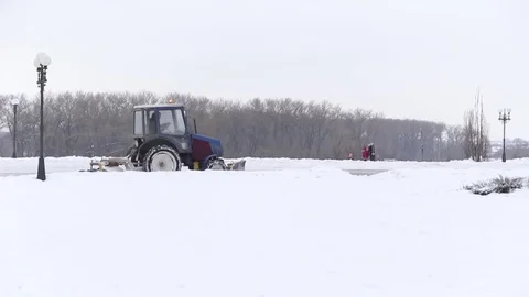 Tractor cleaning snow snowthrower Stock Footage 71945901