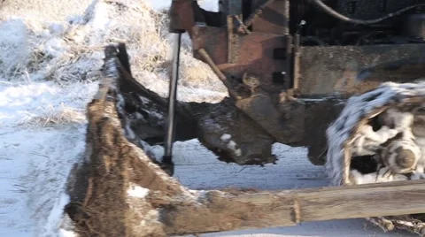 Tractor cleans the farm Stock Footage 60942557