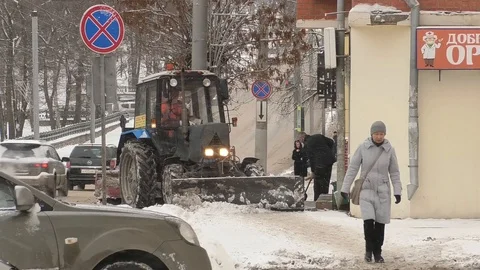 Tractor cleans the sidewalk in winter Stock Footage 123166427