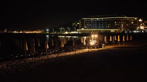 A tractor clears the seashore Stock Footage 336009514