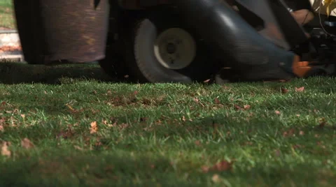 Tractor collecting leaf bits - close-up shot Stock Footage 44781656