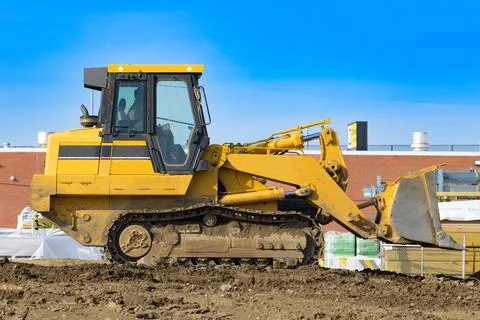 Tractor on a construction site bulldozer work shovel Stock Photos