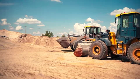 Tractor On Construction Site Carries Rubble Stockbeeldmateriaal 142711998