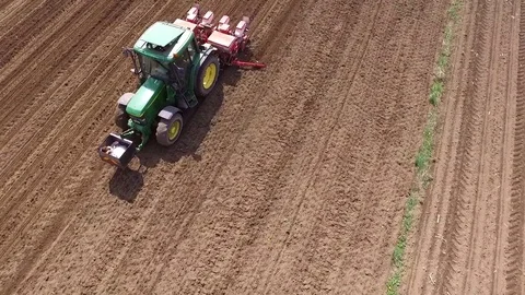 Tractor corn seeding view from the drone Stock Footage 83474326