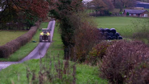 TRACTOR COUNTRY ROAD STATIC 4K Stock Footage 219945519