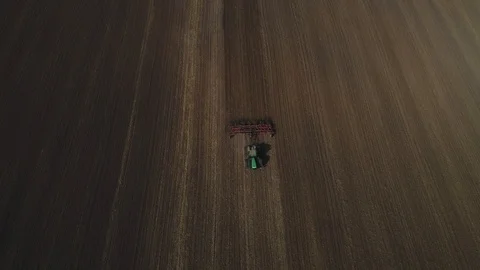 Tractor cultivates the soil Stock Footage 95028746