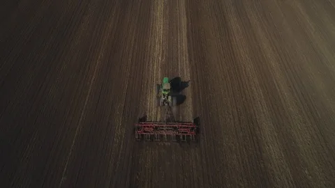 Tractor cultivates the soil Stock Footage 95028807