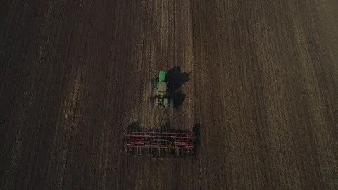 Tractor cultivates the soil Stock Footage 95028872