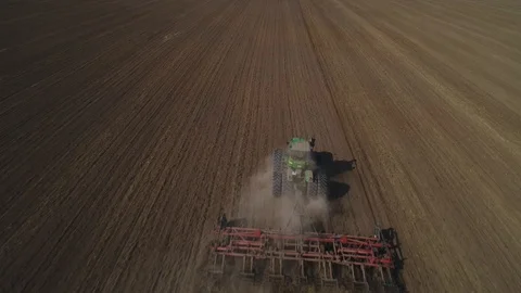 Tractor cultivates the soil Stock Footage 95028944