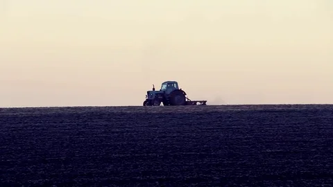 The Tractor Cultivating The Field Stock Footage 82963951