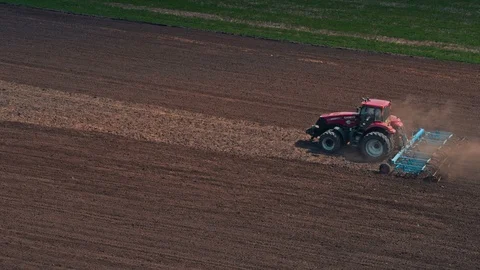 Tractor Cultivating Field At Spring Video stock 88694896