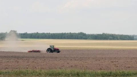 Tractor cultivating fields in the spring Stock Footage 117596487