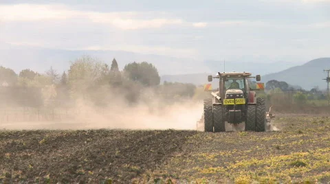 Tractor cultivating front on view Stock Footage 871383