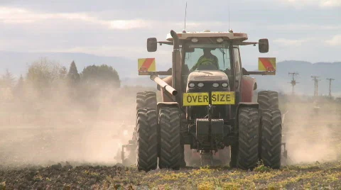 Tractor cultivating viewed from front Stock Footage 867450