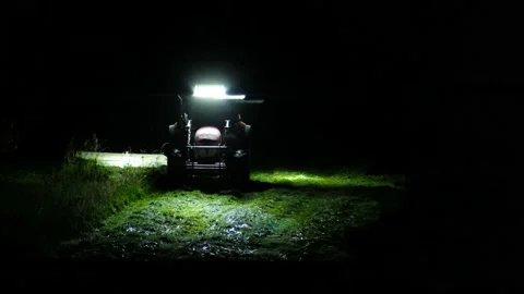 A tractor cuts the grass in the night Video stock 134163426