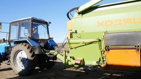 Tractor cuts hay on a farm Stock Footage 103176122