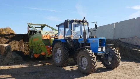 Tractor cuts hay on a farm Stock Footage 103176226