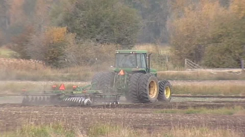 Tractor Cutting Furrows Stock Footage 105993111