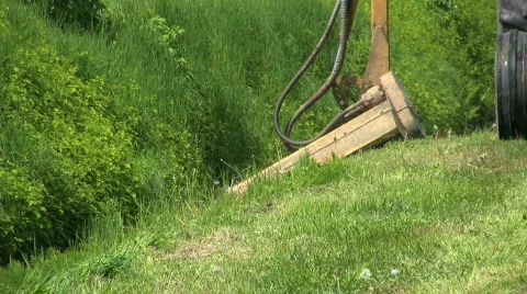 Tractor Cutting Grass In Ditch Close Up (HD 1080p30) Stock Footage