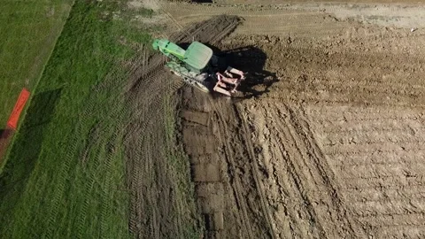 Tractor digging field Stock Footage 163240454