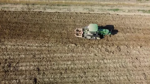 Tractor digging field Stock Footage 163240479