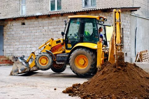 Tractor digging a trench Stock Photos