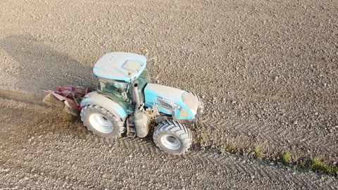 Tractor digs the soil to make water ditches works in the agricultural areas Stock Footage 163809585