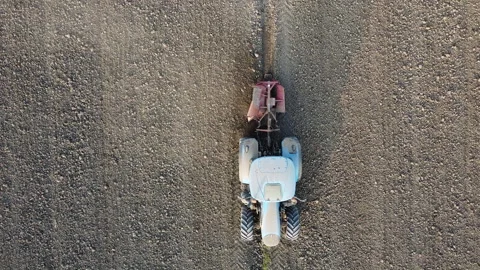Tractor digs the soil to make water ditches works in the agricultural areas Stock Footage 163810449