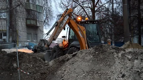 Tractor digs a trench Stock Footage 282561469