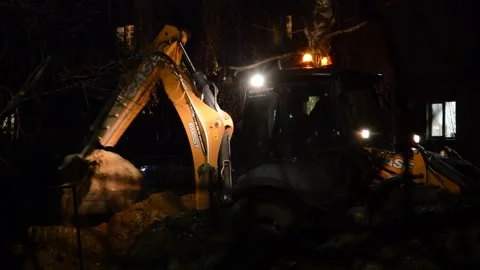 Tractor digs a trench Stock Footage 282563356