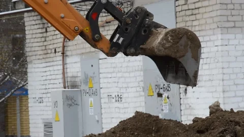 Tractor digs a trench Stock Footage 282564100