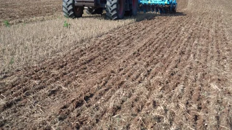 Tractor discing stubble field. Modern technology used to increase soil fertility Stock Footage 132017271