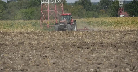 Tractor Distantly Tractor is Plowing The Field Plow Tractor is Approaching Stock Footage 53624935