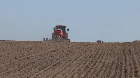 Tractor drilling seeding crops at farm. Video stock 282197632