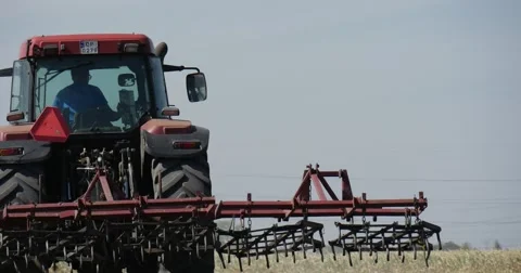 Tractor is Driven By Man Plow is Behind The Tractor Driver Went Out of Tractor Stock Footage 53607510