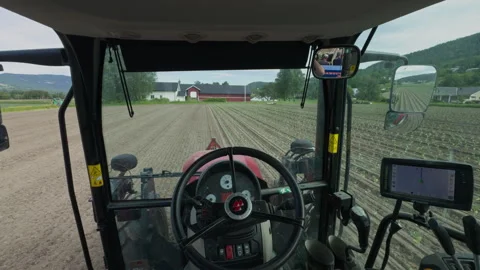 Tractor driver POV looking around cabin interior during autonomous GPS Stock Footage 338319139